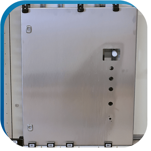 Edelstahltür mit verschieden Ausschnitten nach Kundenvorgabe für einen Schaltschrank.